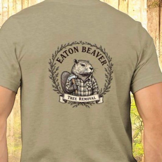 A t-shirt with the 'Eaton Beaver Tree Removal' logo printed on the back, featuring an illustration of a beaver wearing a plaid shirt, by Terribull Tees.
