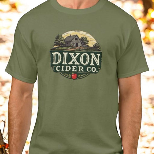 A green t-shirt with the 'DIXON CIDER CO.' logo printed on the front.