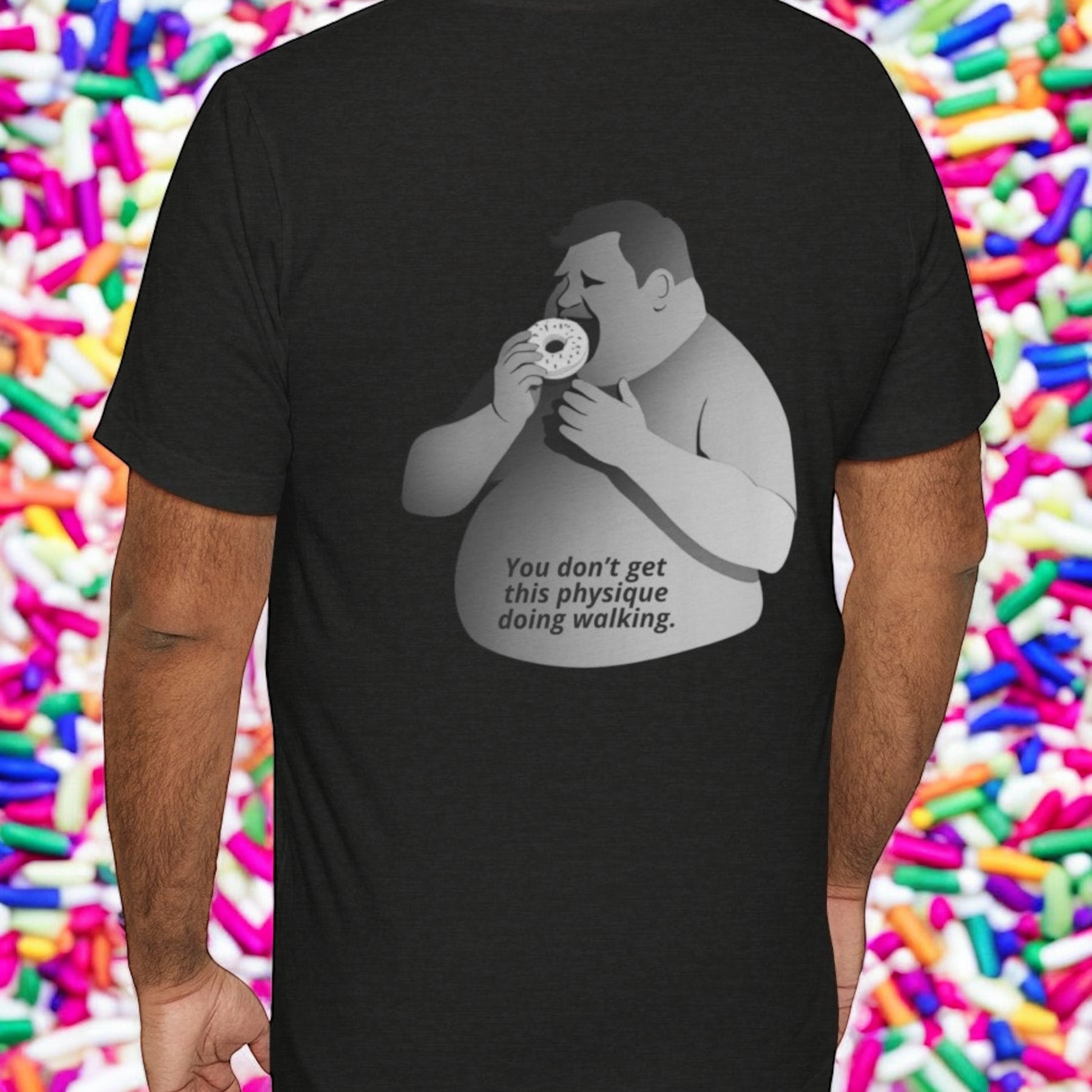 Black t-shirt with graphic of a person eating a donut and text, by Terribull Tees.