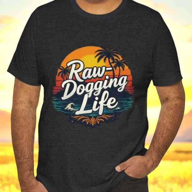 Person wearing a black t-shirt with 'Raw-Dogging Life' graphic design, by Terribull Tees.